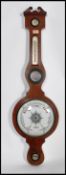 An early 20th century aneroid barometer enamel face with retailers mark for Long and Co Bradnitch to