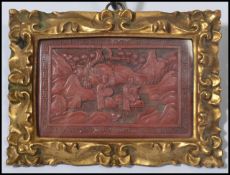 A 19th century Chinese Cinnabar lacquer picture having a Greek key border. The central panel