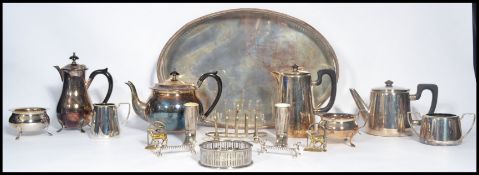 A good collection of silver plated items dating from the early 20th century to include tea sets,
