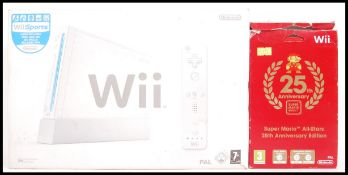 NINTENDO WII & 25TH ANNIVERSARY SUPER MARIO GAME PACK