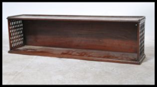 A good Georgian 19th century mahogany lattice worked hanging bookcase shelf. Solid mahogany with