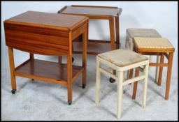A retro mid century teak wood butlers serving trol