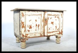 A vintage 20th century up - cycled shabby chic pine cupboard, scrubbed top over twin panel doors