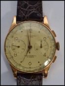 A Chronographe Suisse gentleman's 18 carat gold wristwatch, circa 1950, ref 55 / 105 the four