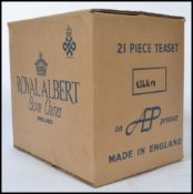 A twenty - one piece bone China tea service by Royal Albert in the Country Roses pattern,