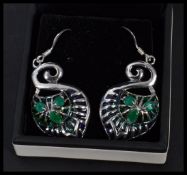 A pair of sterling silver and plique a jour earrings with faux emerald stones. In presentation box.