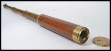 A 20th century mahogany clad brass three drawer telescope with fitted brass cap end, no markings.