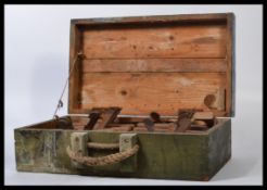 A large collection of vintage 20th century woodworking tools and planes all held within a vintage