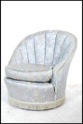 WITHDRAWN An early 20th century ladies bedroom boudoir tub armchair having ribbed bucket back in