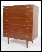 A vintage / retro mid 20th century straight five chest of teak wood chest of drawers raised on