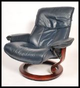 A good quality modernist Swedish Stressless reclining armchair  by Ekornes. Upholstered in dark blue