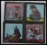 A group of four Victorian Magic Lantern Slides to include seven humorous magic lantern slides of