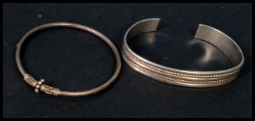 Two 925 silver bangles in the ethinc style. Marked