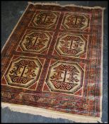 A large Iranian / Persian Keshan carpet - rug having red and beige ground with geometric 6 medallion