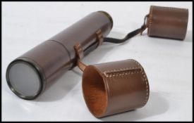 A Denhill de Luxe three draw leather cased telescope, stamped 'Specially made by B C & Co. Ltd,