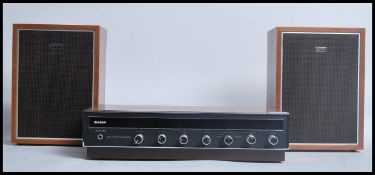 A 1970's Sharp Hi-Fi stereo system with black faci
