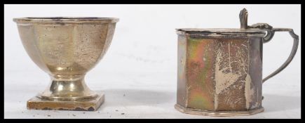 An early 20th century silver hallmarked condiment set of octagonal form consisting of a lidded