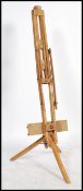 A vintage retro 20th century artist easel of wooden construction having adjustable parts for ease of