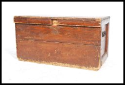 A 19th century Victorian workmans pine blanket box / tool chest with hinged cover having iron drop