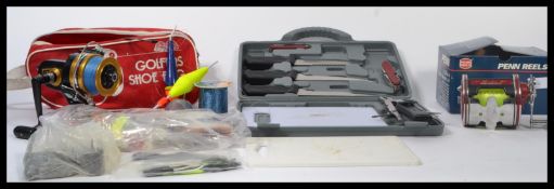 A collection of sea fishing items to include a Penn Special Senator II reel, other reels, floats,