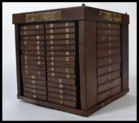 A vintage early 20th century industrial twist action tool , specimen cabinet with multiple