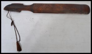 An early 20th century Chinese carved page turner, carved from bamboo with the handle in the form