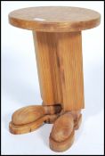 A 20th century novelty wine / side table constructed from pine in the form of a pair of legs and