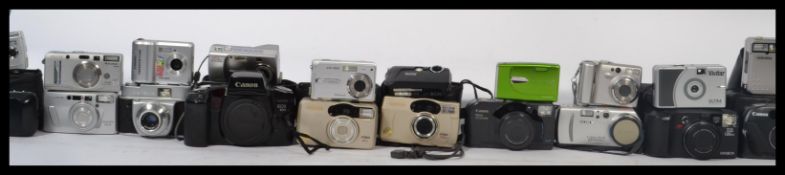 A collectiuon of vintage cameras to include a Sony Cyber Shot , Fujifilm Zoomdate 160s , Olympus