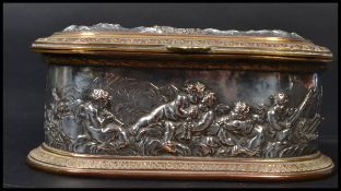 A 19th century Victorian copper and brass jewellery box having silver overlay with relief scenes