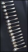 A collection of silver hallmarked teaspoons to include a set of 7 Walker & Hall teaspoons, Sheffield