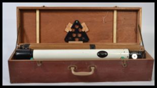 A 20th century cased Astro  Astronomical telescope with optics and wooden tripod. it is 77cm in