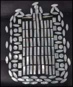 A collection of vintage Chinese jgaming tokens constructed from mother of pearl in the form of Carp,