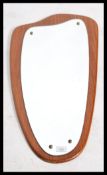 A 20th century vintage retro teak wood wall hanging frame-less mirror of obtuse  form. Measures: