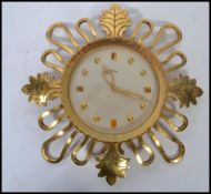 A vintage mid 20th century Swiss made 1950's IMHOF 15 jewel sunburst / starburst wall clock model 73