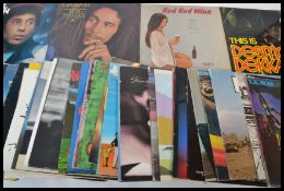 A collection of vinyl long play LP records featuring several artists to include UK Subs, THe Beat,