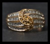 A hallmarked 9ct gold and diamond ring having chan