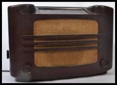 A vintage early 20th century Philips 727a 1930's bakelite valve radio with grille front dials and