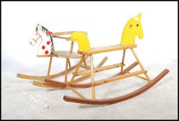2 vintage 20th century wooden childs / childrens seated rocking horses, each of differing design