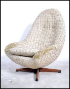 Schrieber - A 1960's retro vintage swivel egg / pod type chair raised on a metal quadruped base with