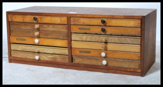 A vintage mid century Industrial wooden 12 drawer collectors specimin cabinet. The wide body with