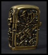 A heavy cast brass vesta case having skeletons and skulls featured heavily