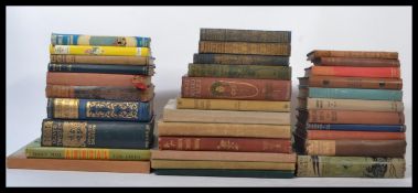 A collection of vintage hard back children's books dating from the early 20th century many different