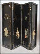 A group of four 20th century Chinese lacquered Shibayama style wall plaques each featuring an