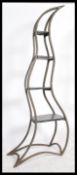 A 20th century abstract free standing four tier shelving unit / planter of metal costruction