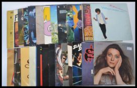 A collection of vinyl Long Play LP records featuring several artists to include Blondie, Asia,