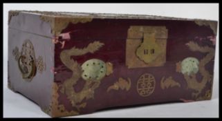 A vintage 20th century Japanese lacquered and brass jewellery box with inset jade detaiuling. it