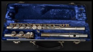 A vintage Elkhart three piece flute musical instrument in original case.