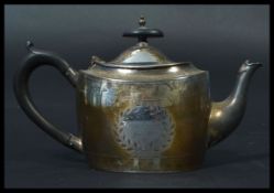 A late VIctorian silver hallmarked teapot by Walker & Hall with ebonised handle.Sheffield