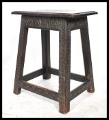 A believed 18th & 19th century Jacobean revival carved peg jointed oak stool. The stool with heavily