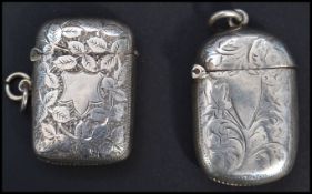 Two silver hallmarked match Vesta case having a fitted hinged lids, chase decorated with foliate